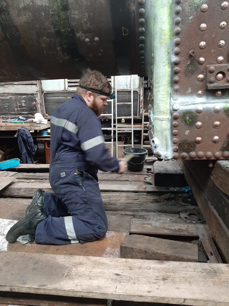Adam Wright testing Cumbria's firebox rivets