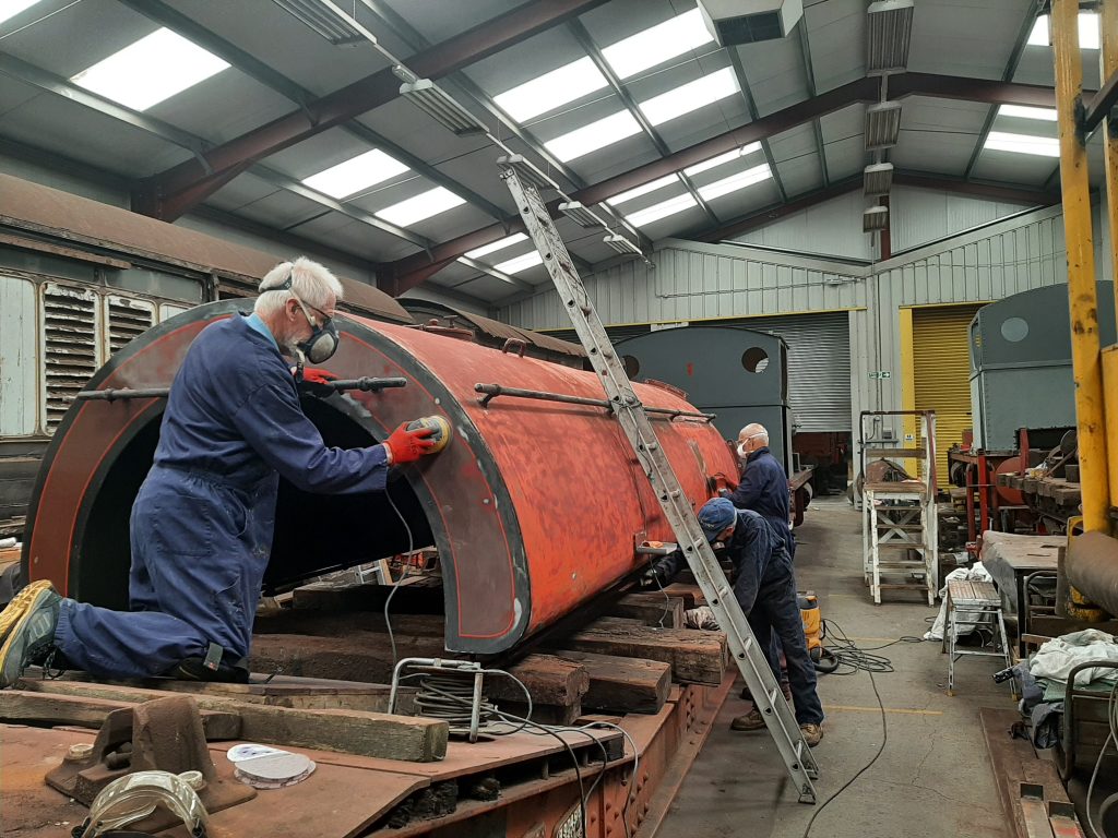 Sim, Jon and Paul Kelly sanding Cumbria's saddletank