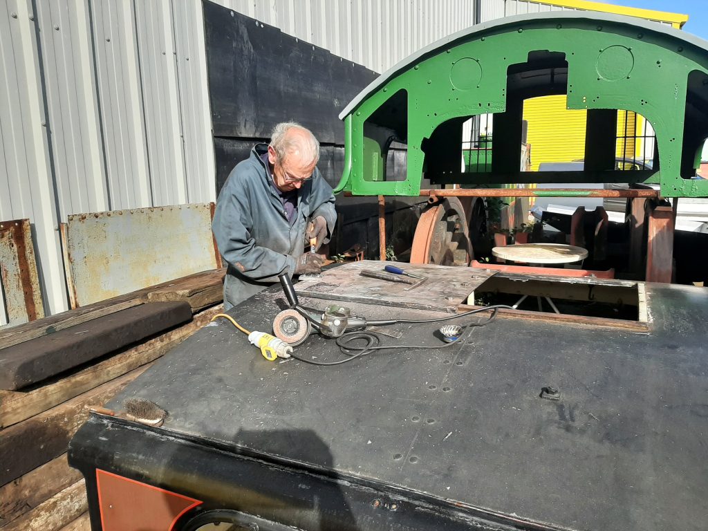 John working on Cumbria's cab roof
